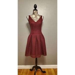 Ashley Graham Beyond burgundy dress